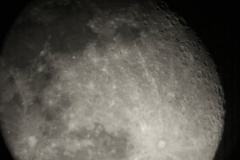 Plane crossing in from of the Moon